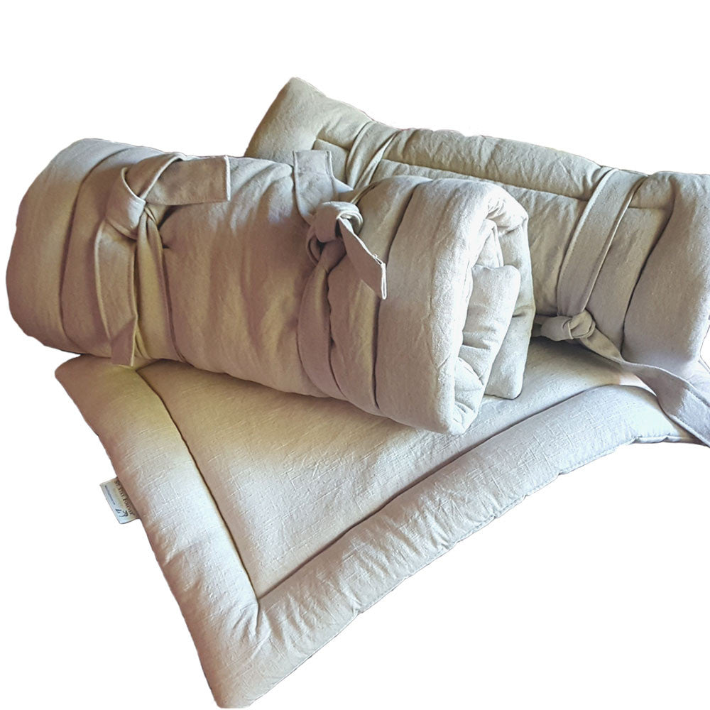 Sit.Stay.Forever. Organic Cotton Human Nap Pad in Beige, rolled up and laid out.