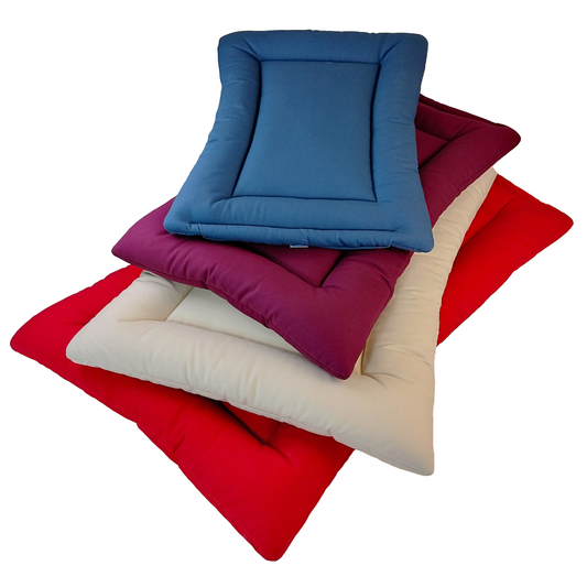 Pile of red, beige, plum, and navy blue colored Organic Cotton Square Dog Beds,  organic dog bed