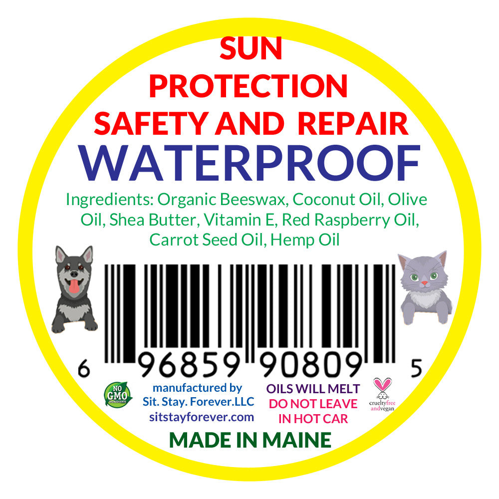 The back label of Sit.Stay.Forever sunscreen listing ingredients like organic beeswax, coconut oil, olive oil, shea butter, vitamin E, red raspberry oil, carrot seed oil, and hemp oil. The label also includes a barcode and small illustrations of a dog and a cat.