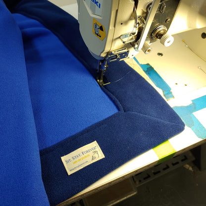 Blue oxin Free Plush and Curly Velour Throw being sewed 