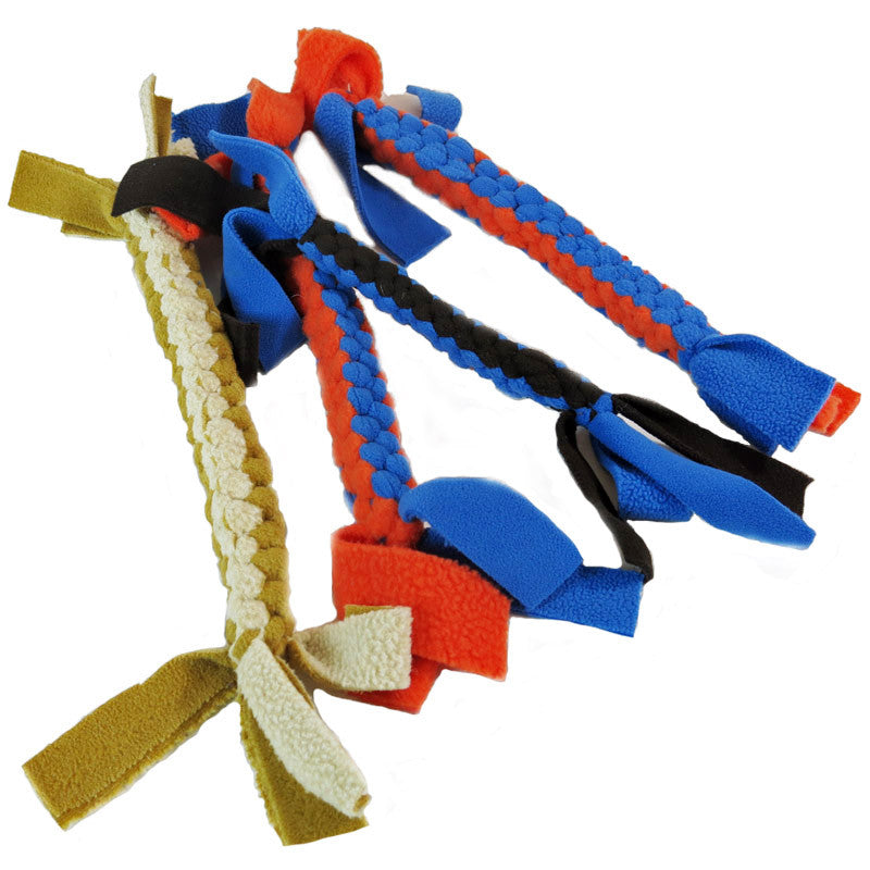 A variety of non-toxic braided dog toys from Sit.Stay.Forever in different colors, including blue, orange, black, and beige.