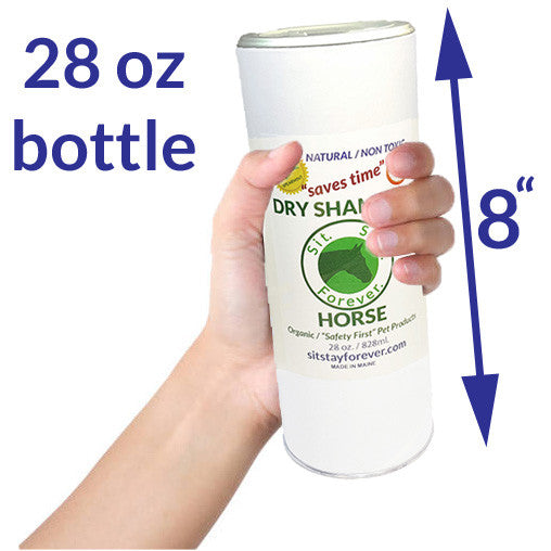A hand holding a 28 oz bottle of Sit.Stay.Forever. dry shampoo for horses, labeled as natural and non-toxic. The bottle is 8 inches tall, as indicated by the arrow and text in the image.