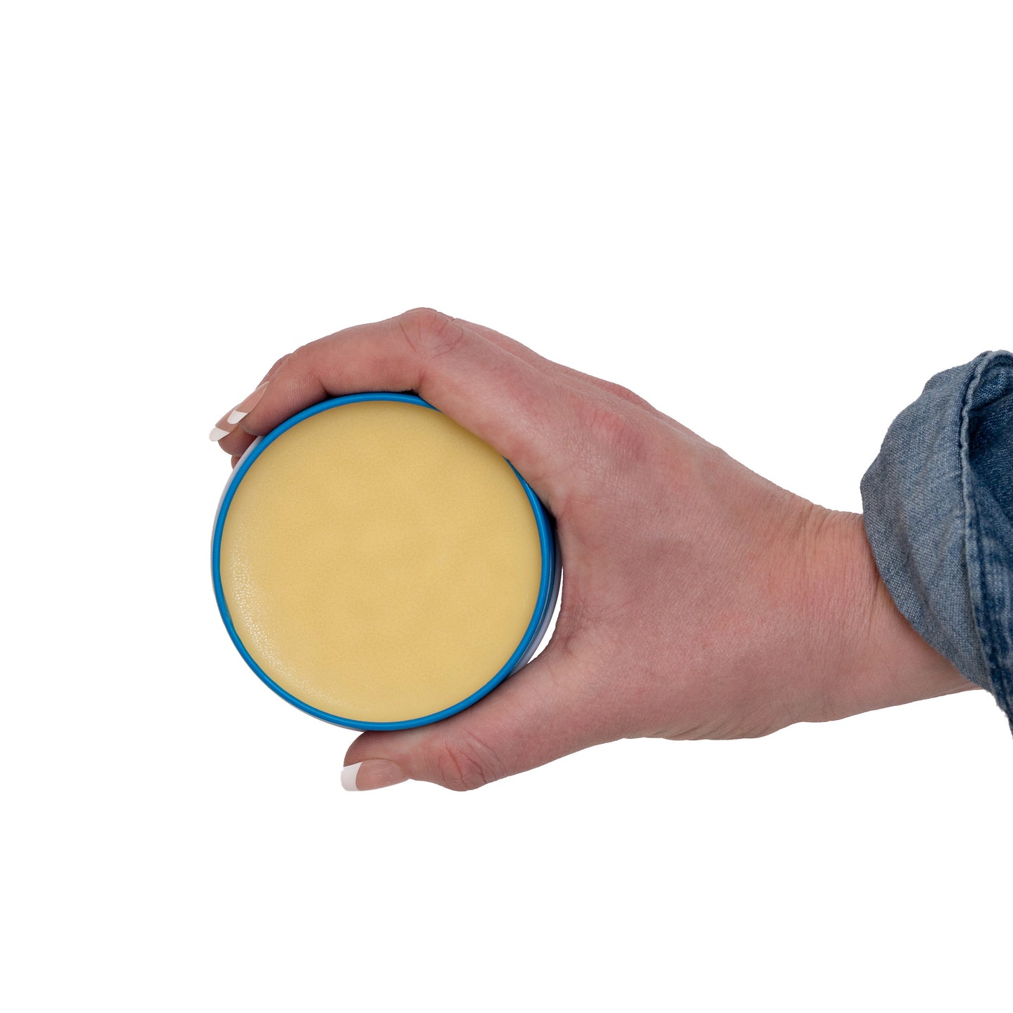 Hand holding inside of the Horse Daily Care Balm.