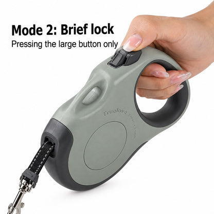 Hand pressing the quick brake on a retractable dog leash